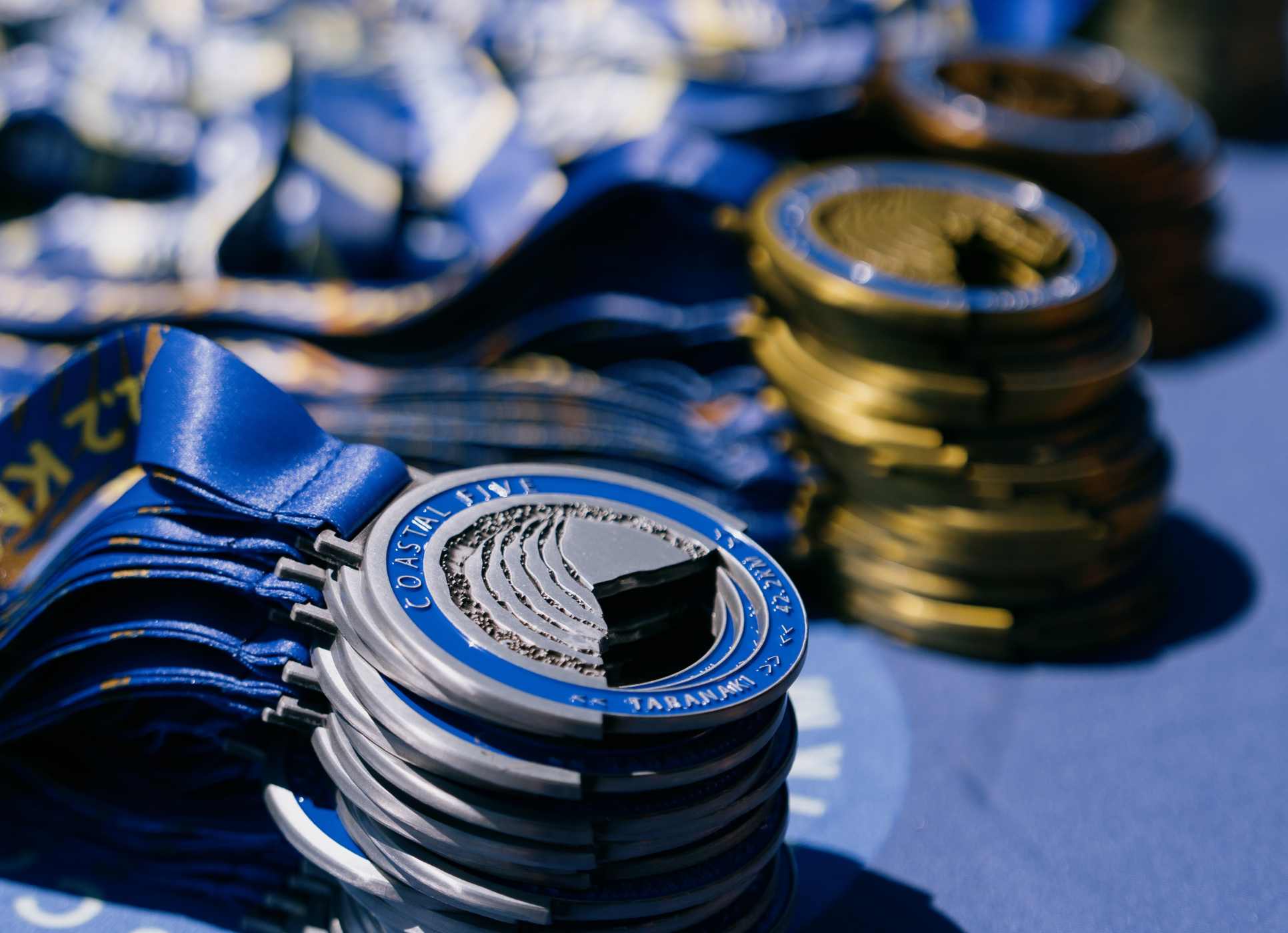 Run all 5 and earn your medal Medals at the Coastal Five